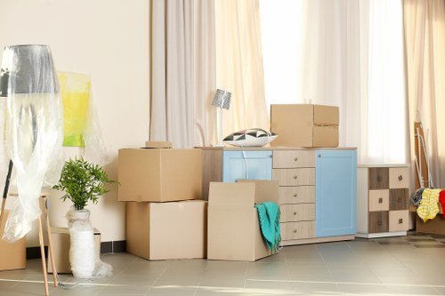 Unpacking boxes in a Balham flat after moving day