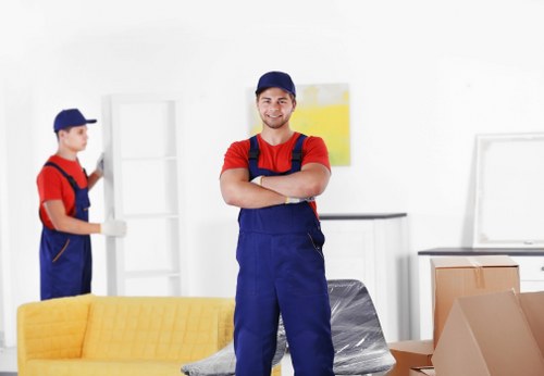 Removal van and moving team in a Balham residential street