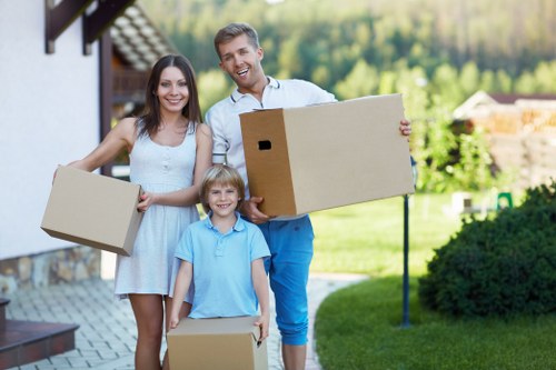 Packed moving boxes and furniture ready for a house removal in Balham