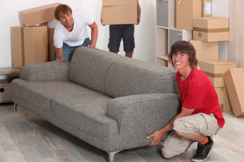 Relocation team moving office equipment in Balham