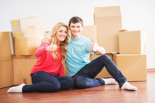Local moving team loading boxes and furniture in Balham