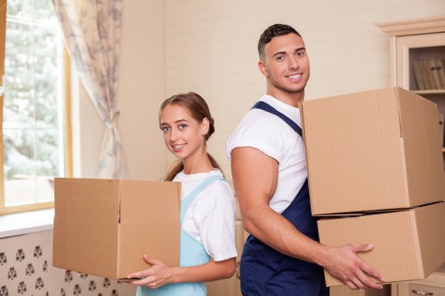 Man with a van assisting with boxes and furniture delivery
